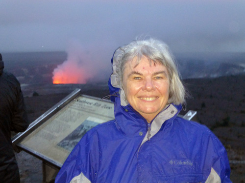 Nancy Harrison poses at Halema'uma'u crater atop Kilauea volcano