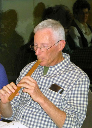 Robert "Buzz" Bernstein plays a recorder 