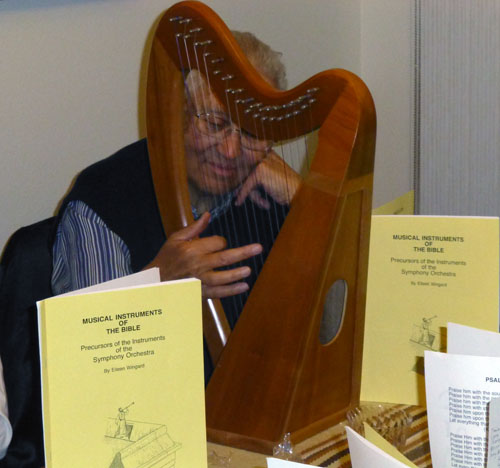 Steve Bomer plays a harp during biblical music demonstration