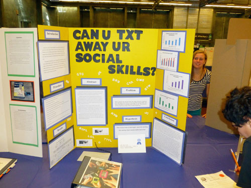 Shor Masori, right, takes notes on a project at the Greater San Diego Science and Engineering Fair