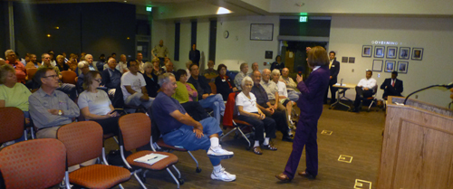 Susan Davis steps in front of the podium to take questions at Town Hall meeting at Grossmont College