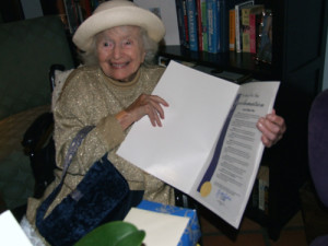 A happy Laura Simon, approaching her 108th birthday,  displays mayoral proclamation declaring Nov. 26th to be her day in San Diego