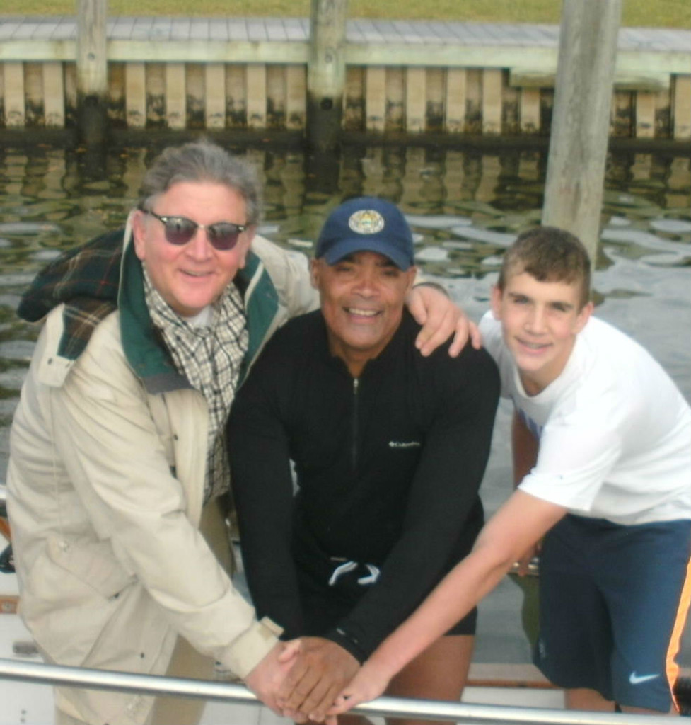  Steve Fleischer, left, and son, flank Victor Mooney 