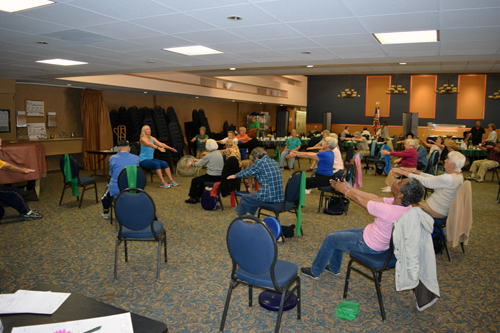 Older adults participate in an exercise class at JFS College Center