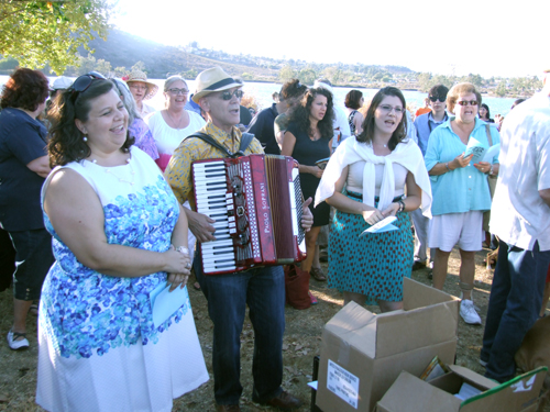 Front row, from left, Rabbi Devorah Marcus of Temple Emanu-El; Rabbi Leonard Rosenthal of Tifereth Israel Synagogue, and Cheryl Katz, cantorial soloist of Tifereth Israel, lead songs during Tashlich service at Lake Murray