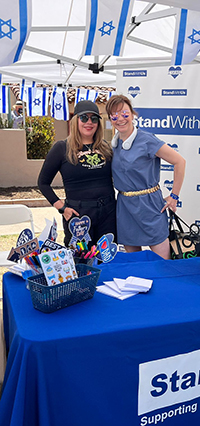 Tallie Fears, left, and Mary Endress took Polaroid photos of visitors to the StandWithUs booth (Photo: Ashley Levy)